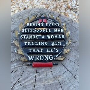 Behind every man is a woman metal sign